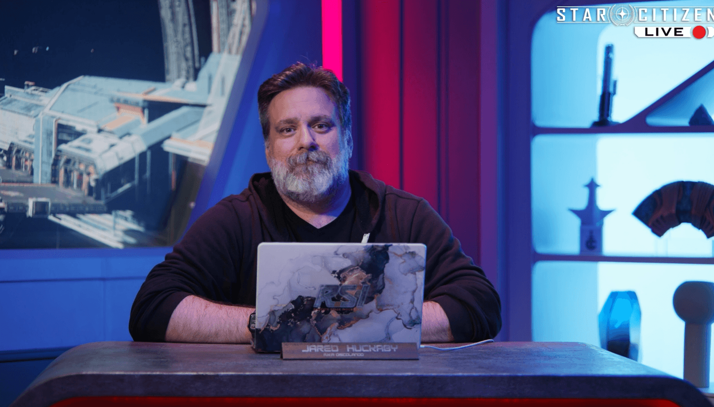 It can be seen on the middle shelf.