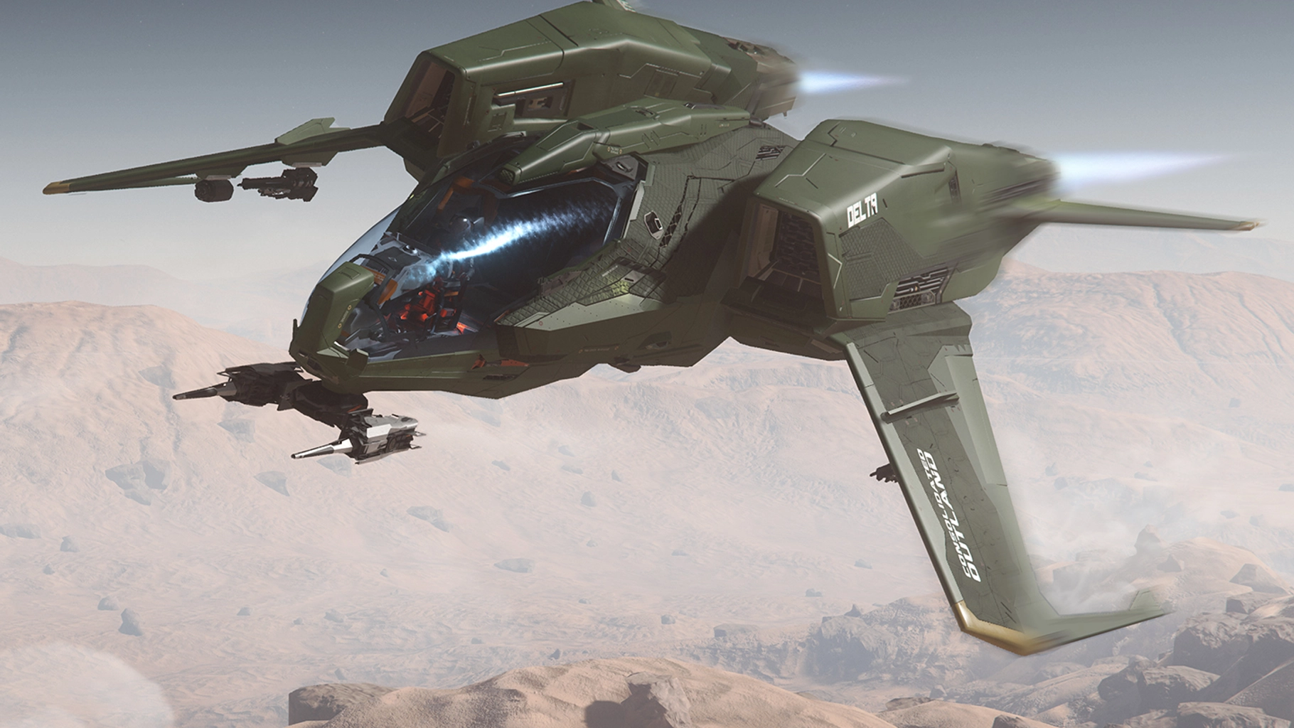 Green Mustang Delta flying over terrain