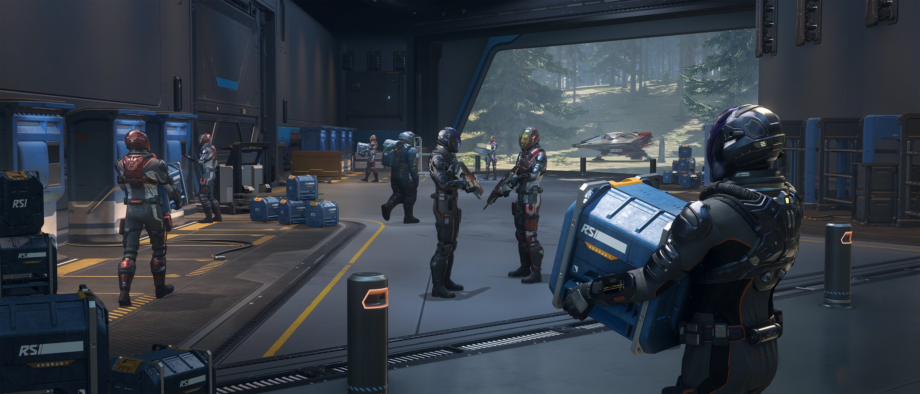 Crew member carrying an RSI supply box beside an event installation