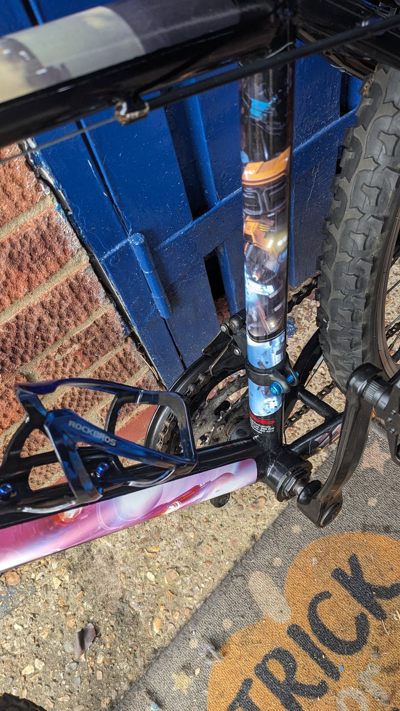 bottle holder, I will never use but looks cool. and a little bit of grabby hands moth on the upright.