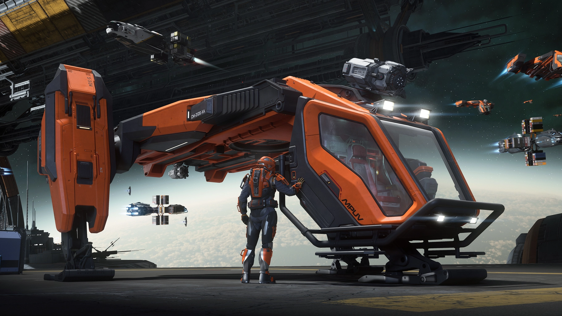 Argo MPUV Tractor parked in a busy hangar